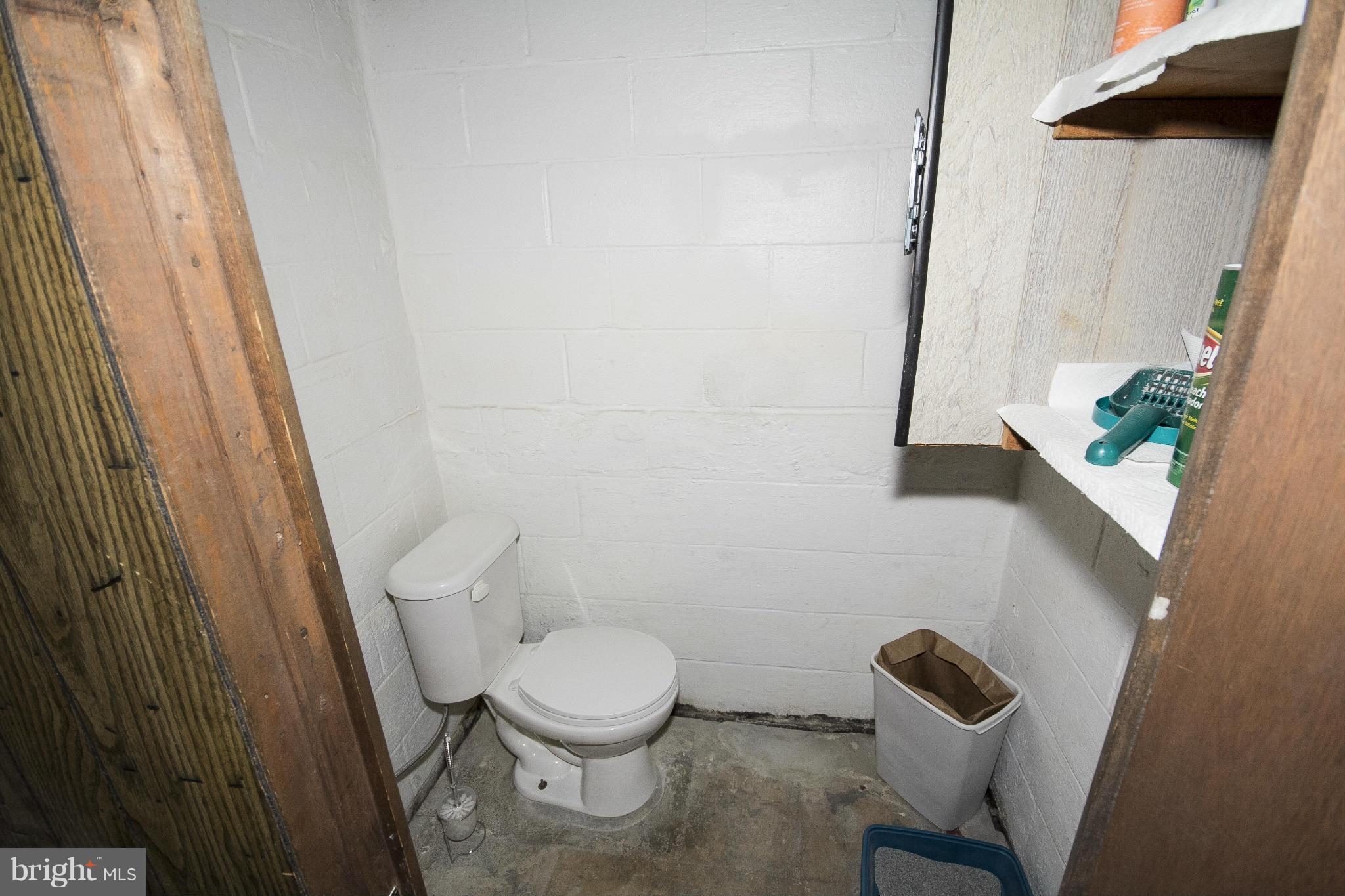 2136 Cockspur Road Baltimore, MD 21220 - Photo 17 of 20 a white toilet sitting next to a sink