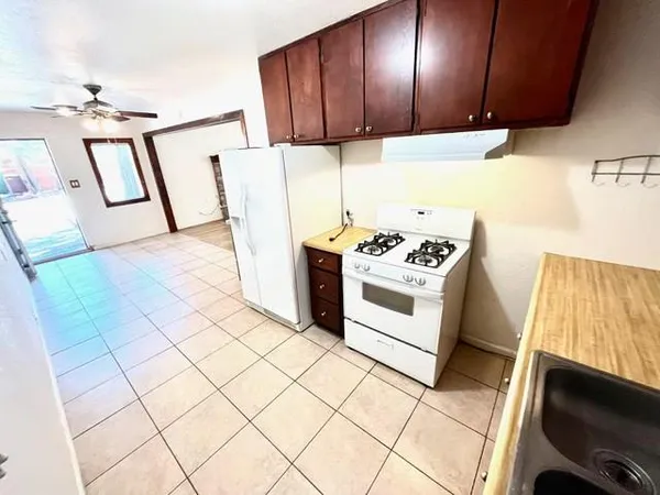 a bathroom with a sink a toilet and a shower