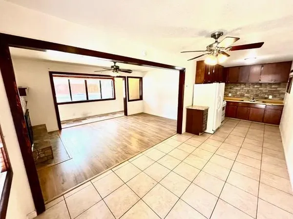 a view of a room with wooden floor