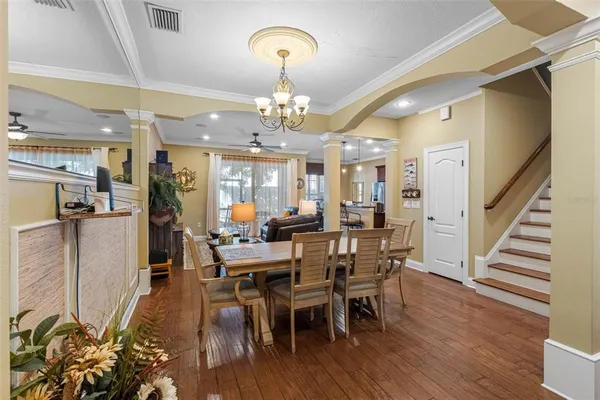 a view of a dining room with furniture and wooden floor