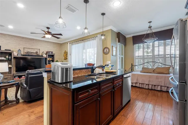 a kitchen with stainless steel appliances granite countertop a stove and a refrigerator