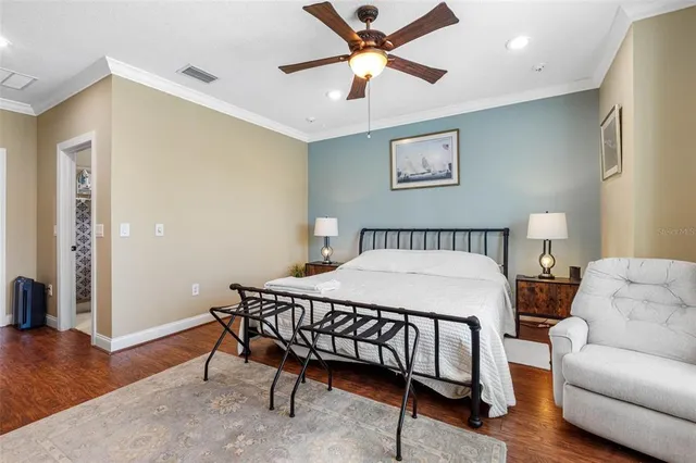 a bedroom with a bed and a table in it