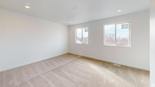 783 Pheasantbrook Drive, Unit 2A Centerville, UT 84014 - Photo 29 of 41 Expansive room featuring two large windows, recessed ceiling lighting, and neutral carpeting