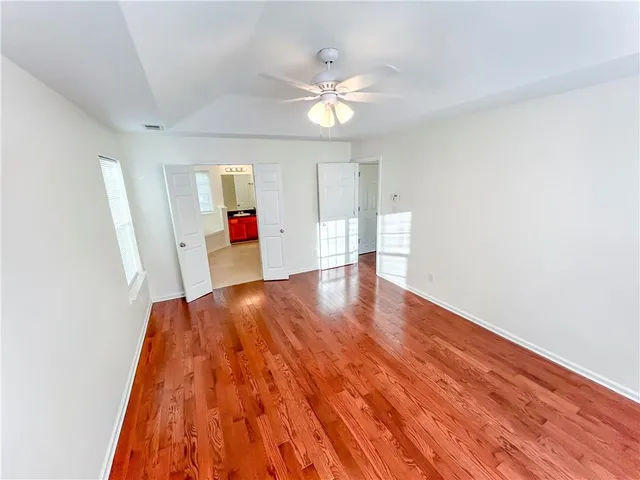 a view of livingroom with hardwood floor and ceiling fan