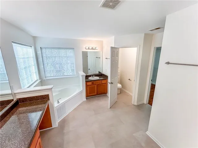 a bedroom with a bed and a cabinets