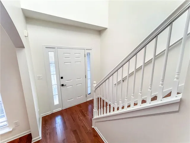 a view of entryway with wooden floor