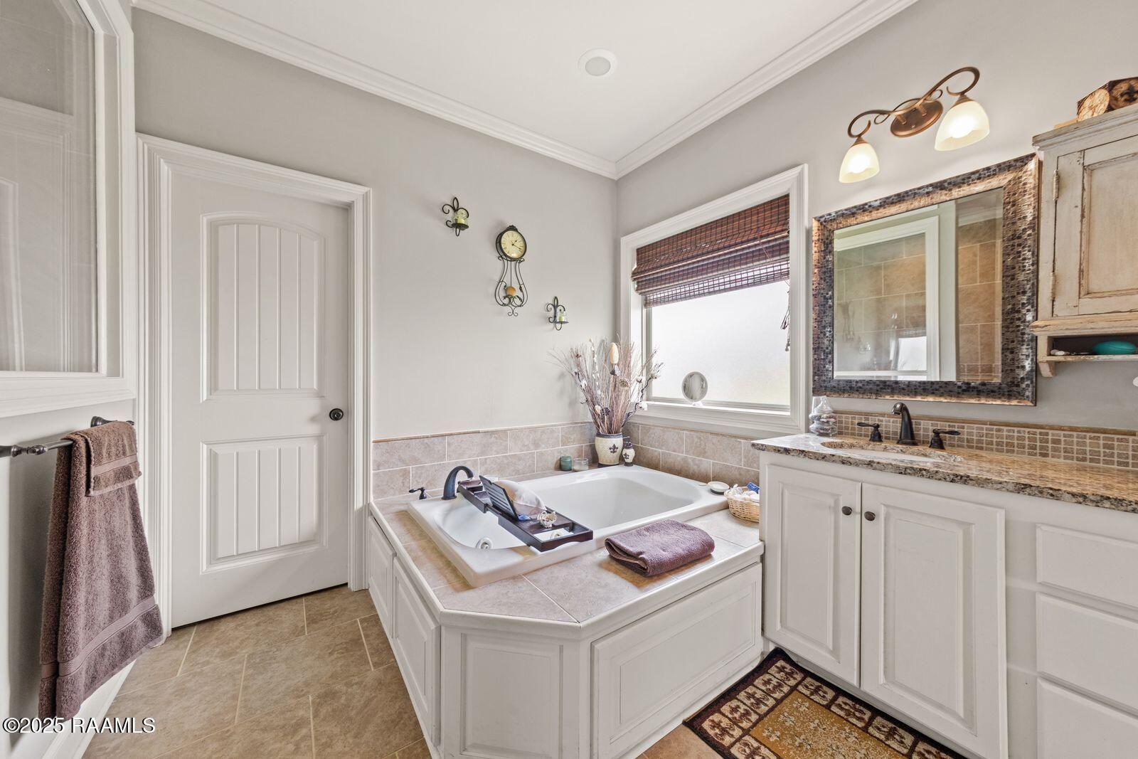 1181 Grand Loop Breaux Bridge, LA 70517 - Photo 13 of 40 Jetted tub and double sinks in primary b