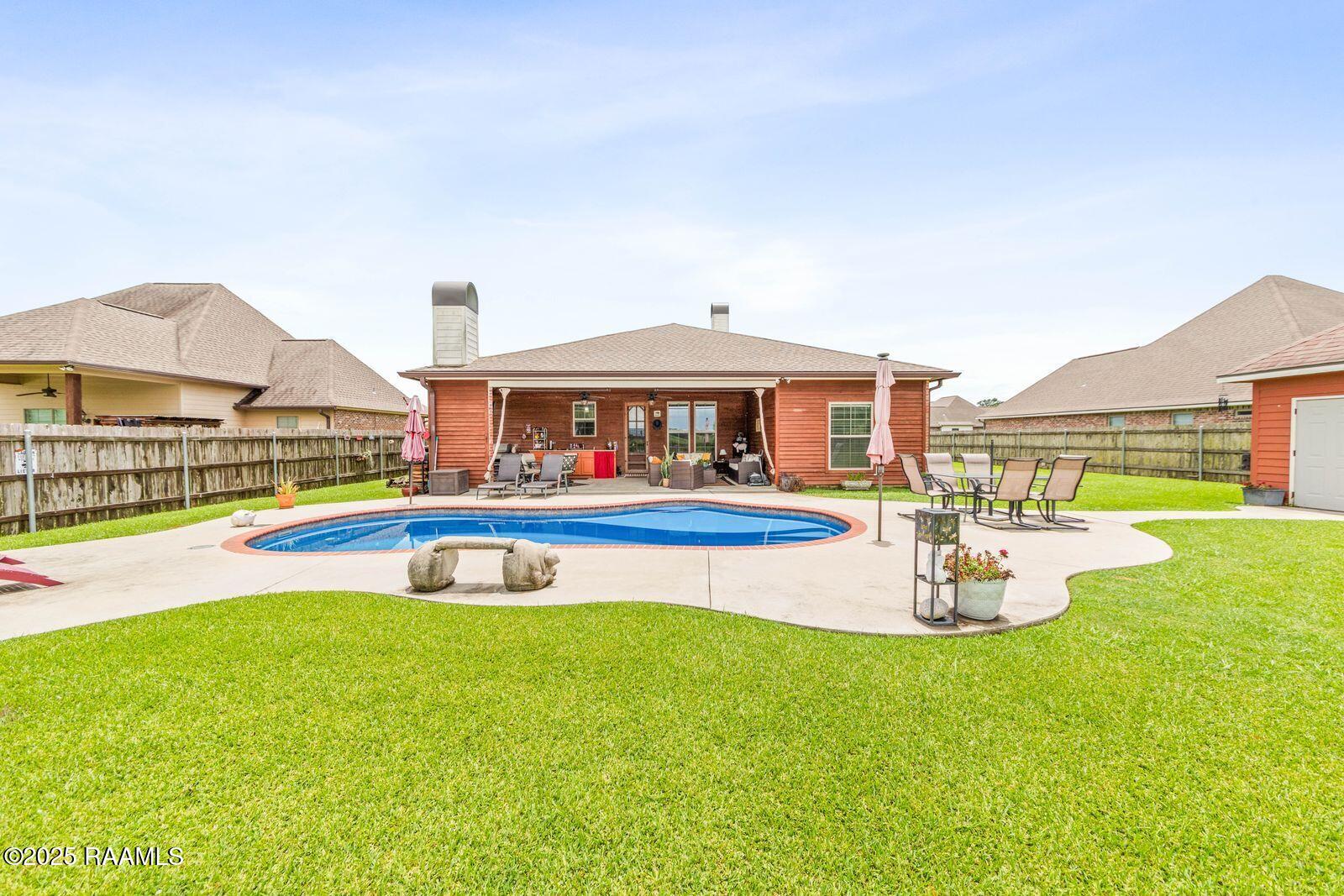 1181 Grand Loop Breaux Bridge, LA 70517 - Photo 27 of 40 Backyard features inground pool with wat