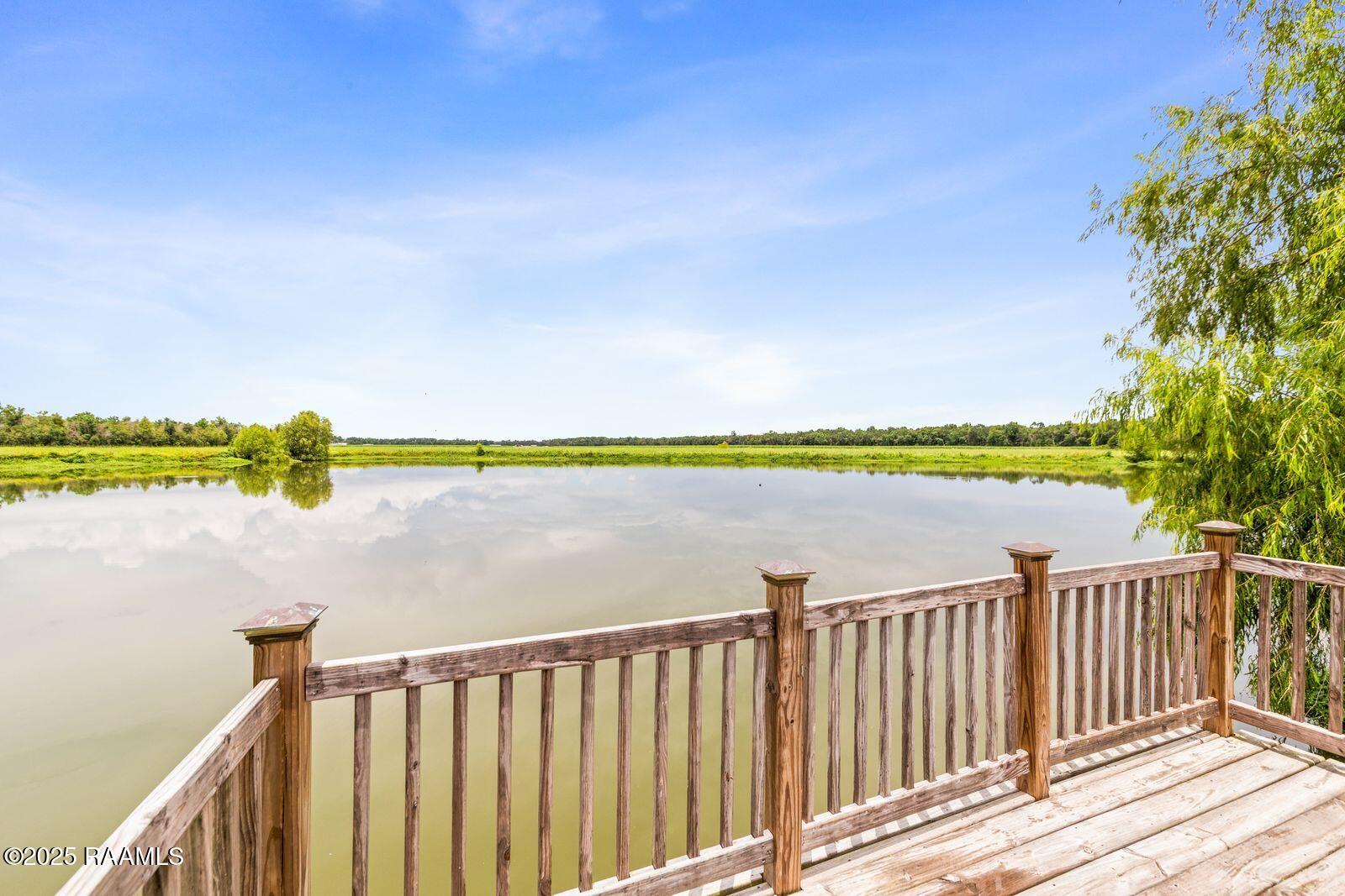 1181 Grand Loop Breaux Bridge, LA 70517 - Photo 32 of 40 Pond and dock