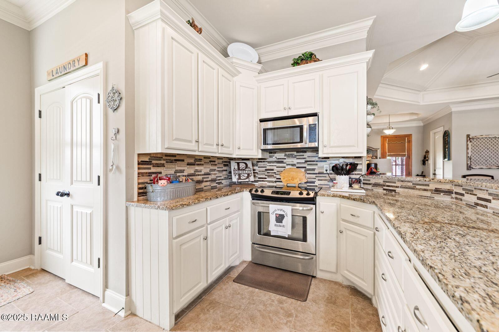 1181 Grand Loop Breaux Bridge, LA 70517 - Photo 9 of 40 Kitchen and laundry area