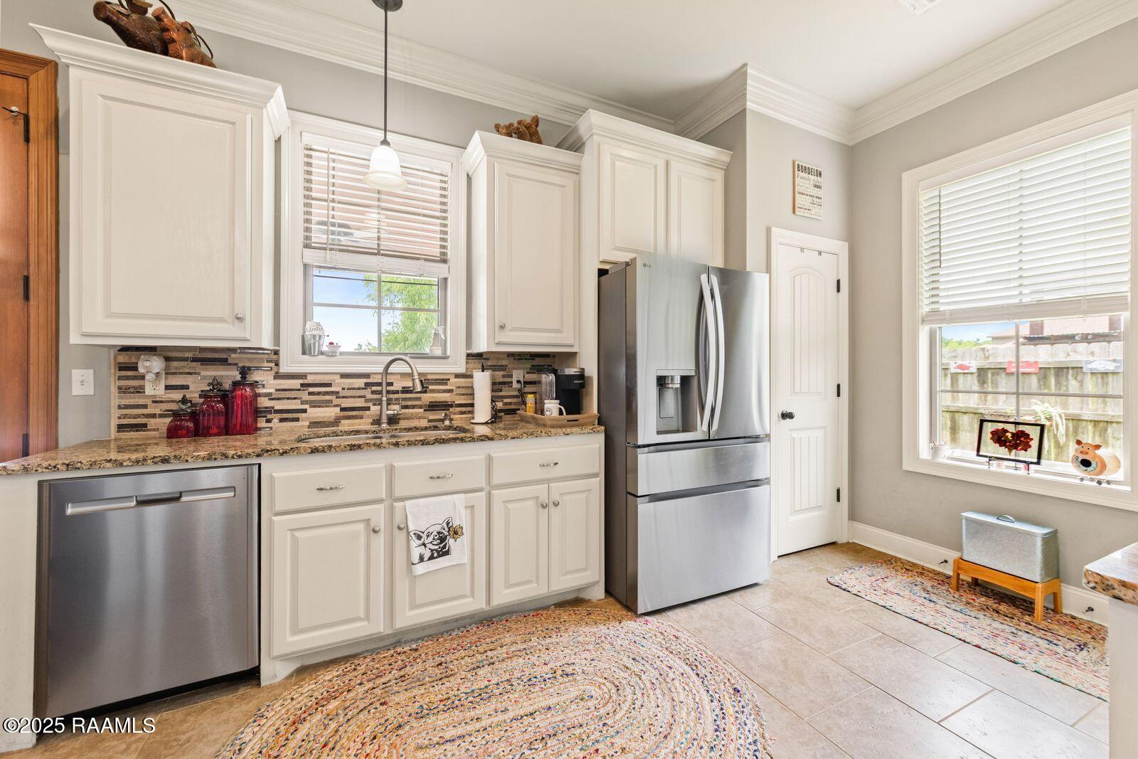 1181 Grand Loop Breaux Bridge, LA 70517 - Photo 10 of 40 Enjoy backyard view from kitchen