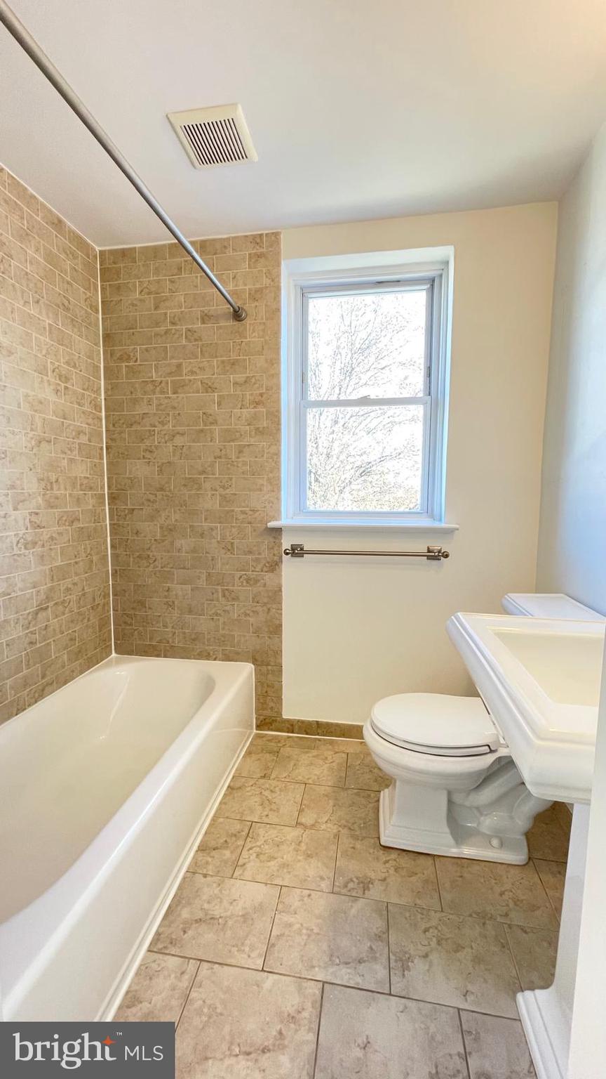 5358 Delmar Road Clifton Heights, PA 19018 - Photo 12 of 30 a bathroom with a toilet a sink and bathtub
