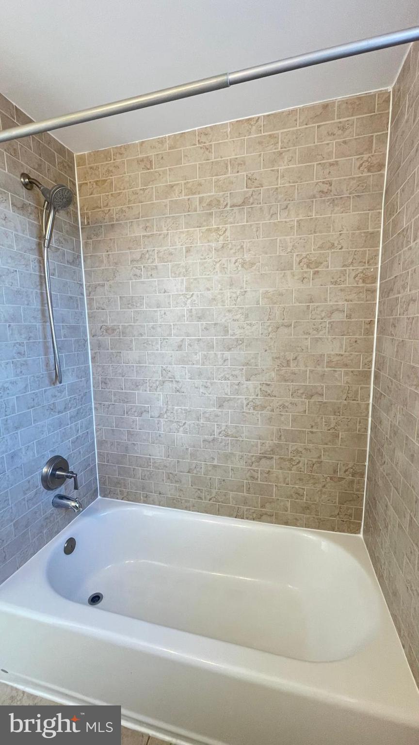 5358 Delmar Road Clifton Heights, PA 19018 - Photo 15 of 30 a bathroom with a shower and a bath tub