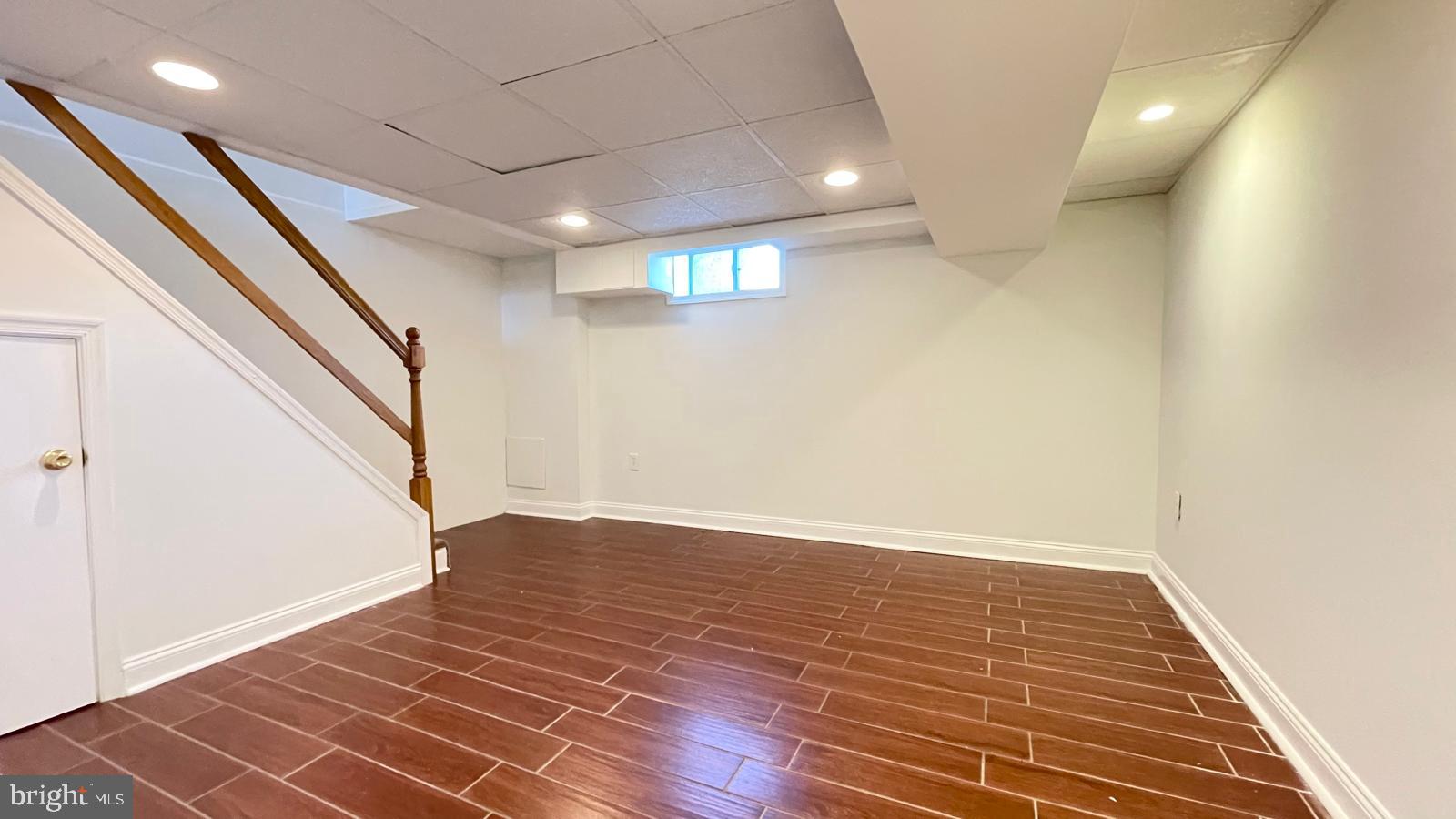 5358 Delmar Road Clifton Heights, PA 19018 - Photo 26 of 30 a view of an empty room with wooden floor and stairs