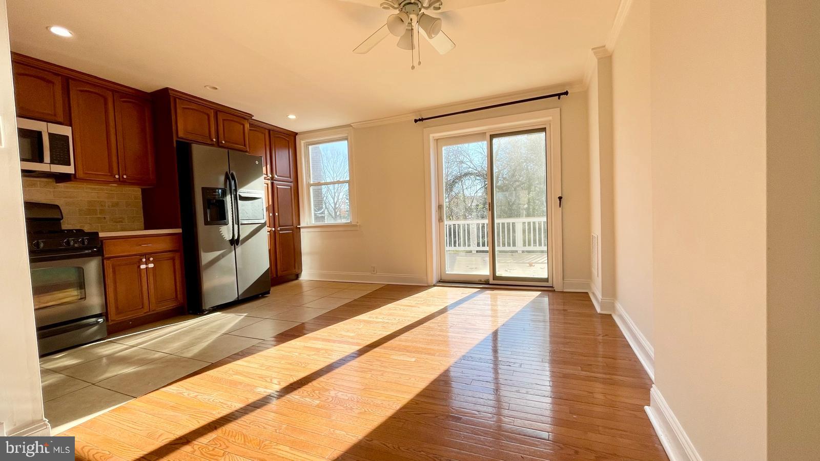 5358 Delmar Road Clifton Heights, PA 19018 - Photo 6 of 30 a spacious bedroom with a bed and a chandelier