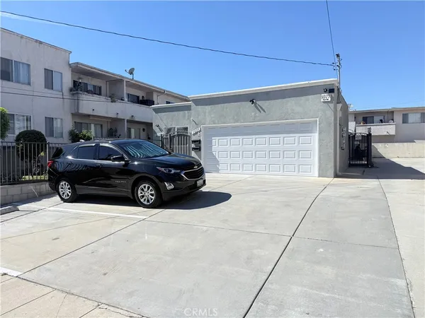 a view of a car parked in front of a building