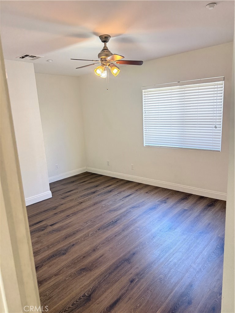 1025 Edith Avenue Alhambra, CA 91803 - Photo 3 of 11 an empty room with wooden floor and windows