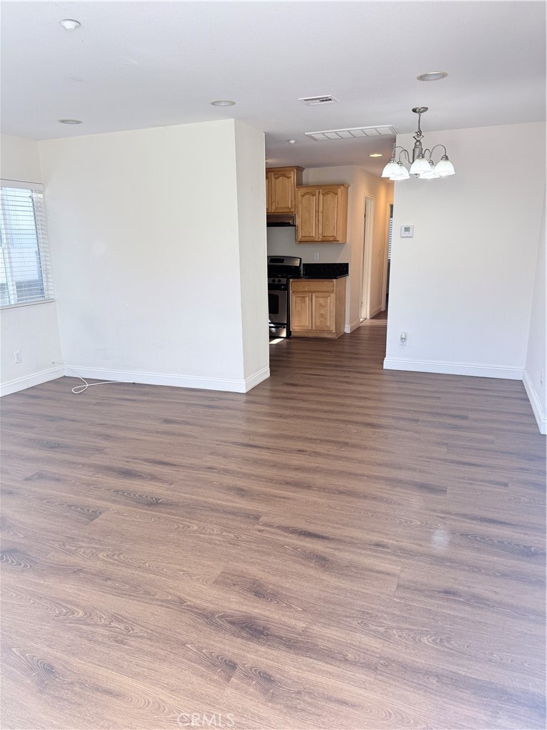 1025 Edith Avenue Alhambra, CA 91803 - Photo 5 of 11 a view of a kitchen with wooden floor and a refrigerator