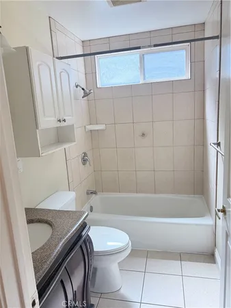 a view of room with wooden floor and fan