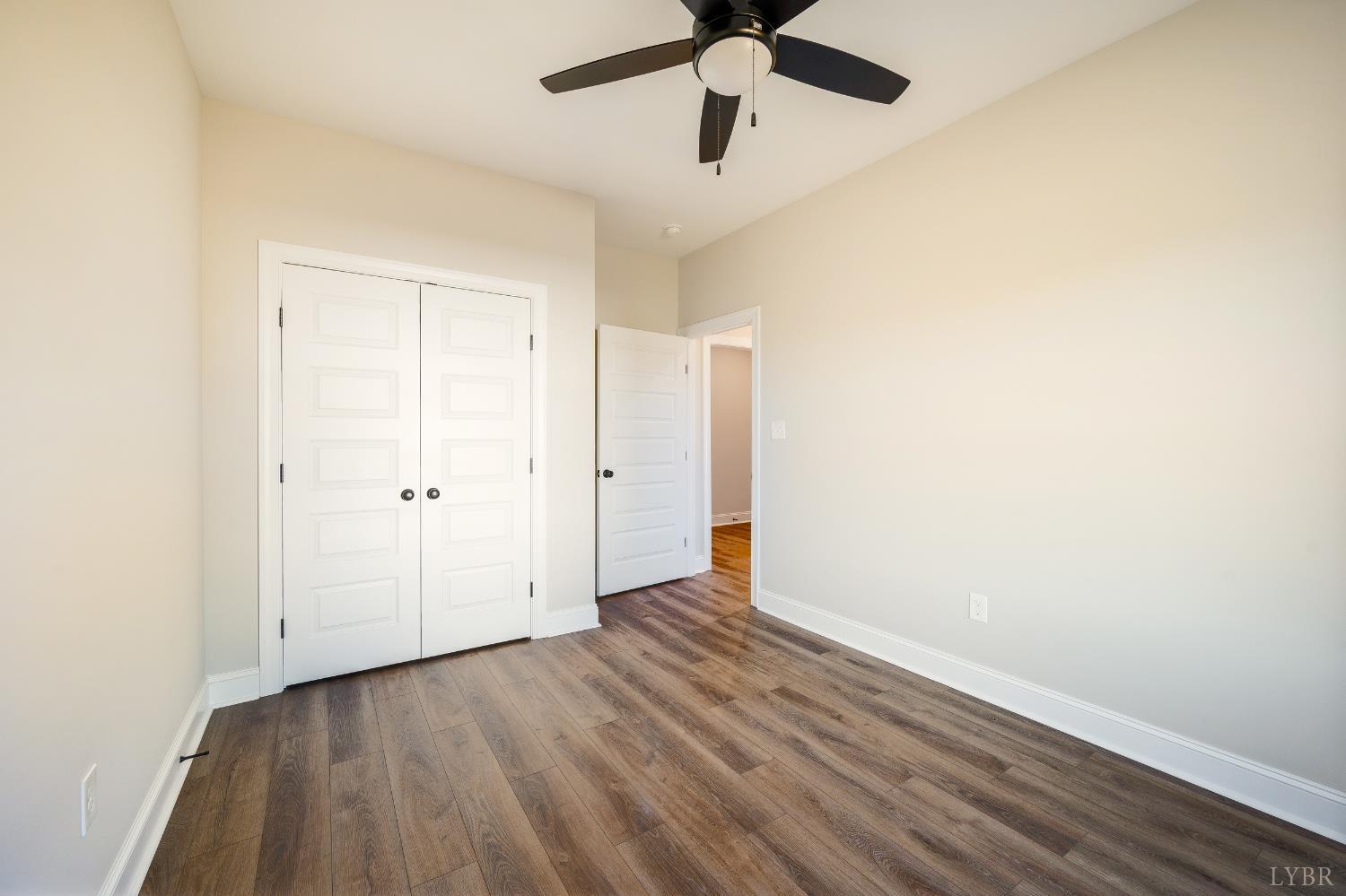 10556 Leesville Road Lynch Station, VA 24571 - Photo 11 of 64 a view of an empty room with wooden floor