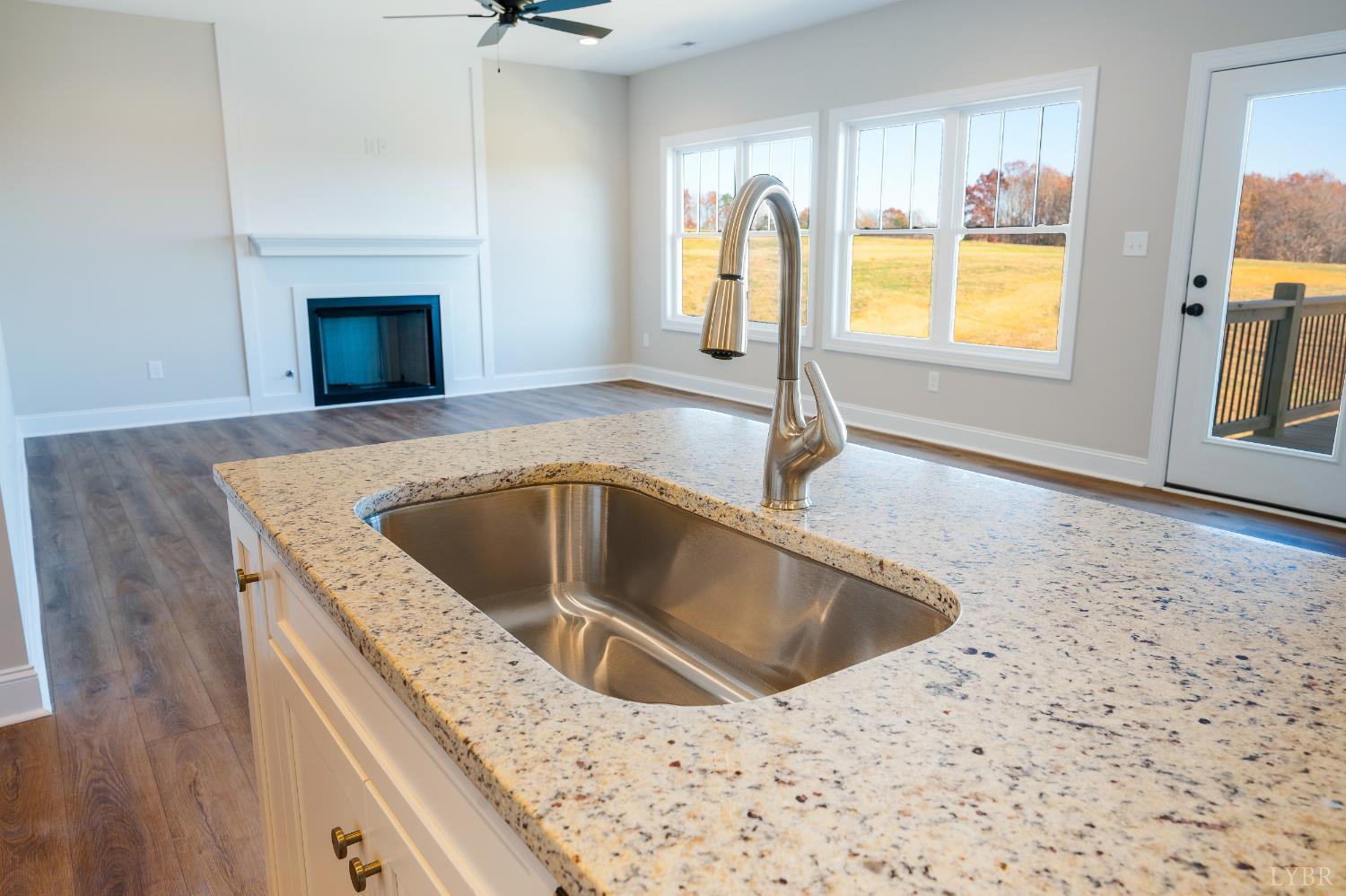 10556 Leesville Road Lynch Station, VA 24571 - Photo 22 of 64 a kitchen with a sink cabinets and a fireplace