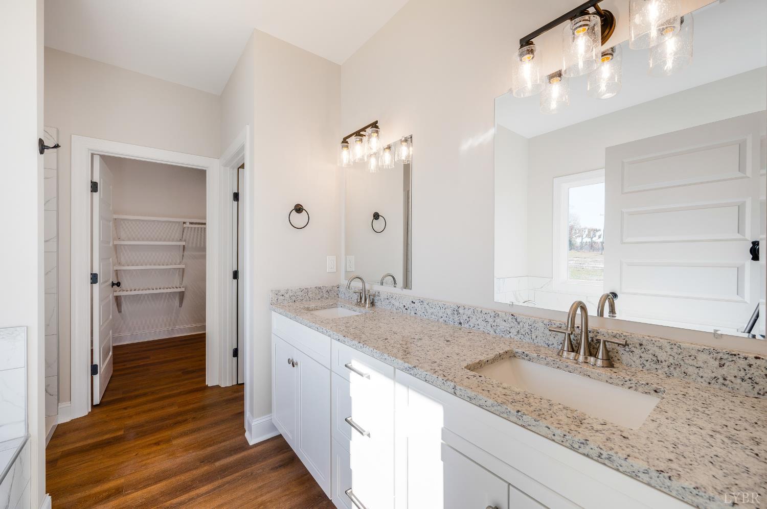 10556 Leesville Road Lynch Station, VA 24571 - Photo 31 of 64 a bathroom with a granite countertop sink and a mirror