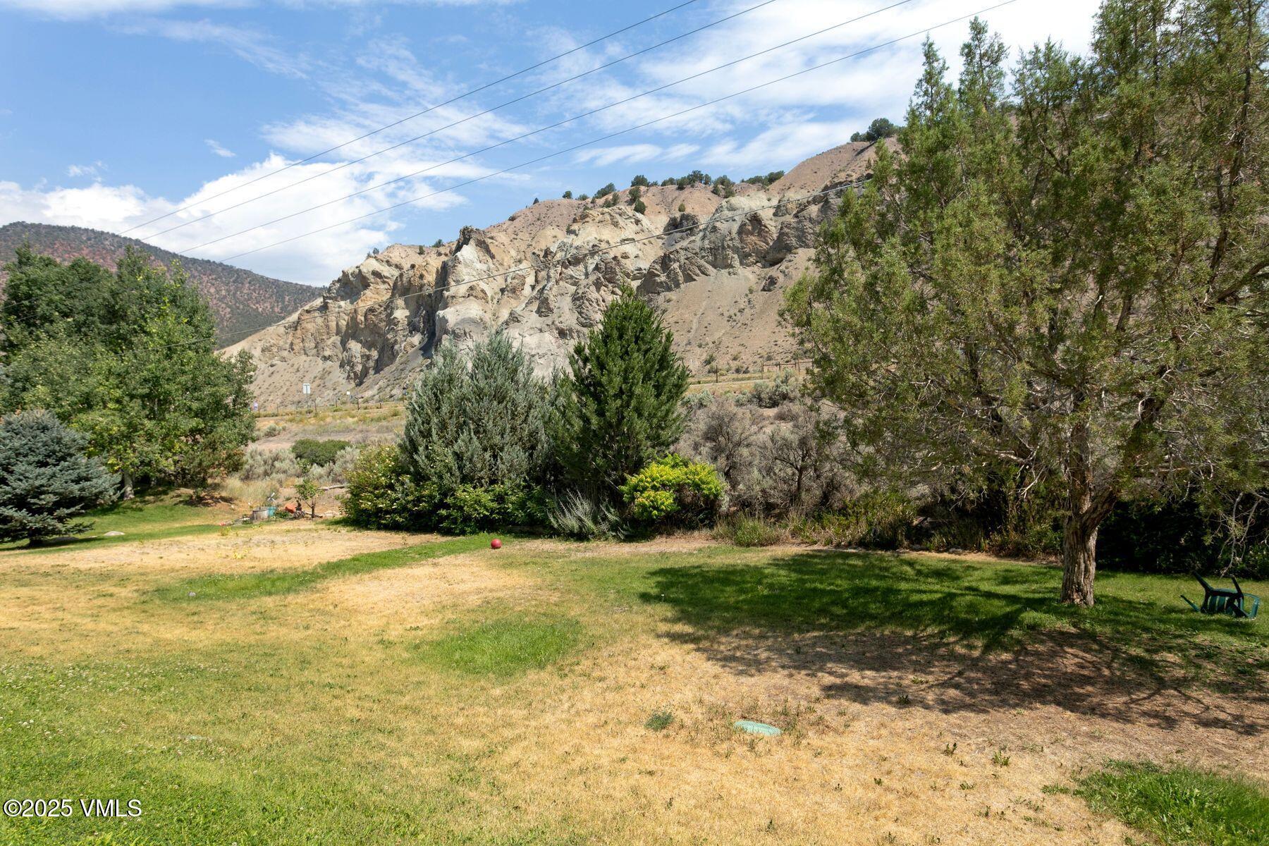 600 Price Lane, Unit 1 Gypsum, CO 81637 - Photo 14 of 26 a view of a yard with a house