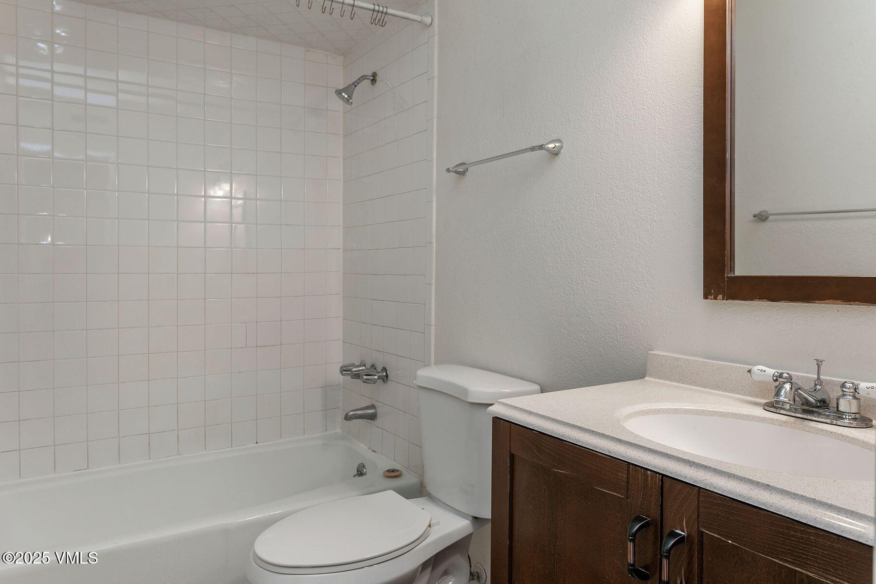600 Price Lane, Unit 1 Gypsum, CO 81637 - Photo 17 of 26 a bathroom with a sink toilet and shower