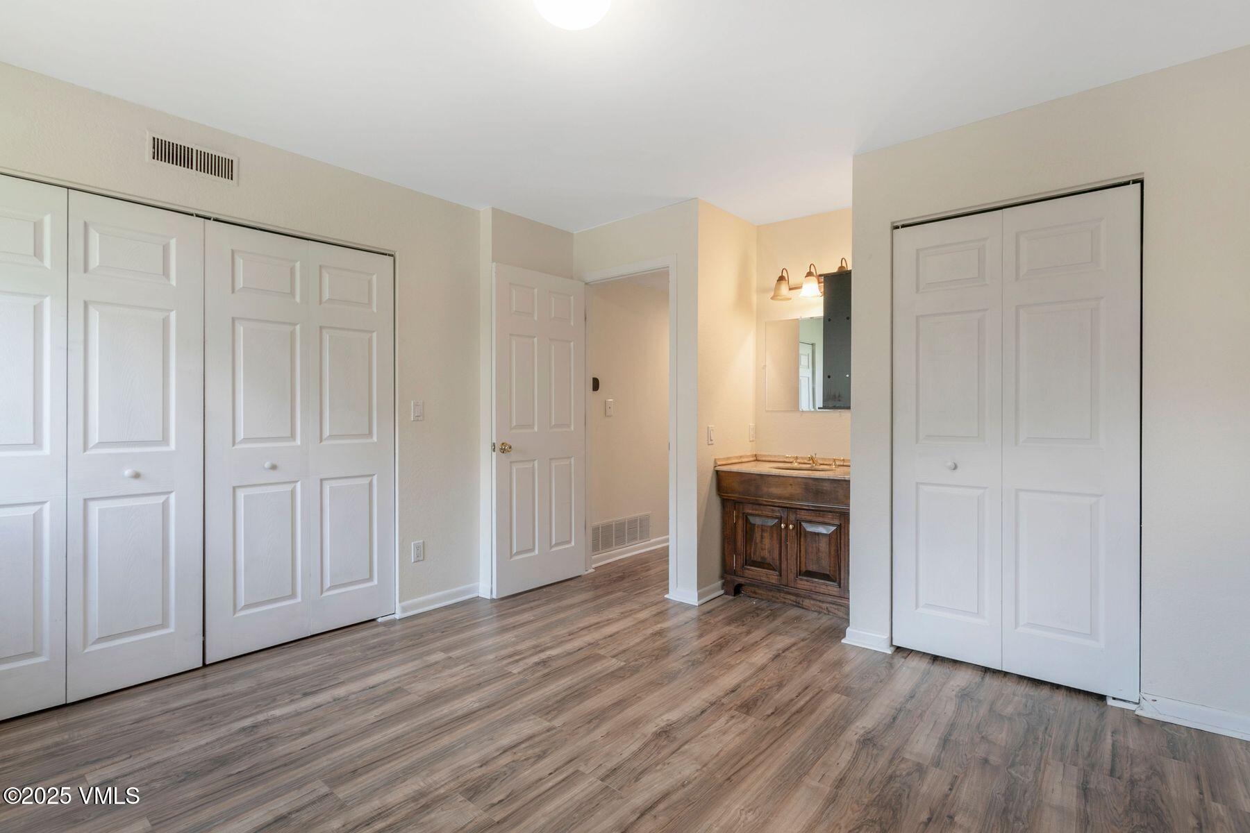 600 Price Lane, Unit 1 Gypsum, CO 81637 - Photo 19 of 26 a view of a livingroom with furniture and wooden floor