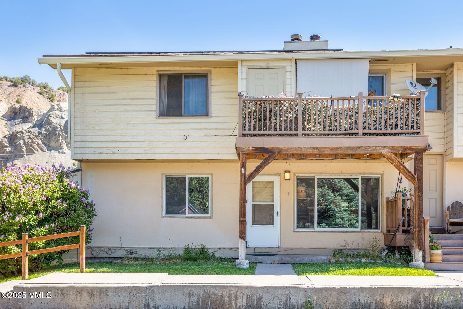 600 Price Lane, Unit 1 Gypsum, CO 81637 - Photo 23 of 26 a front view of a house with a yard