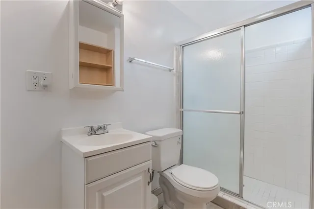a bathroom with a sink toilet and vanity