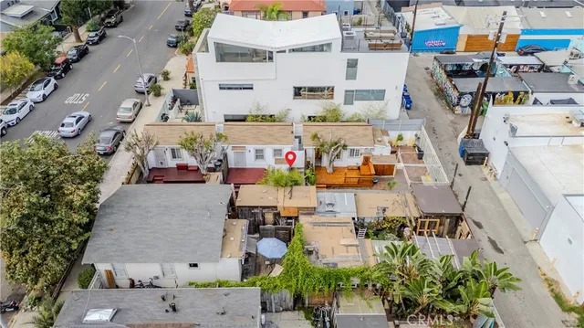 an aerial view of multiple houses with yard