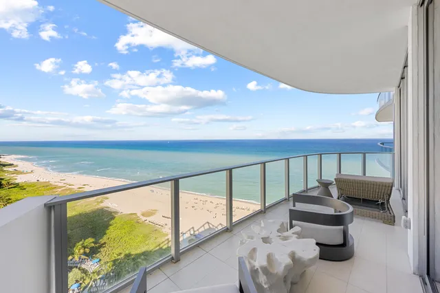 a balcony with view of ocean
