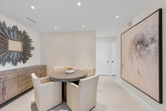 a view of a hallway with seating area