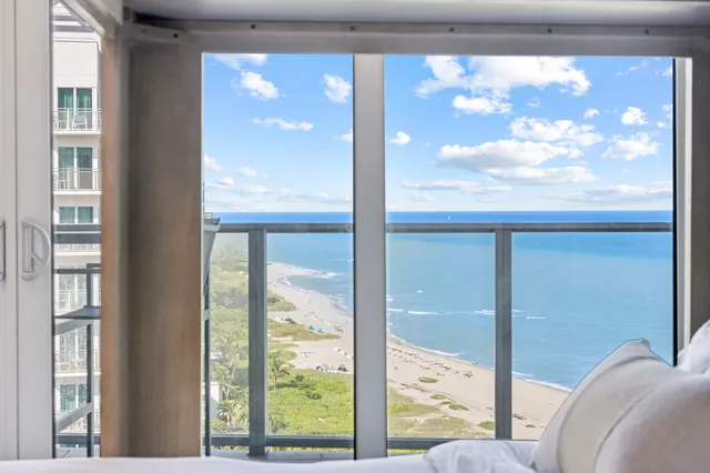 a view of a glass door with a balcony