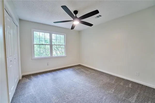 a view of an entryway with a flower pot and a wooden floor