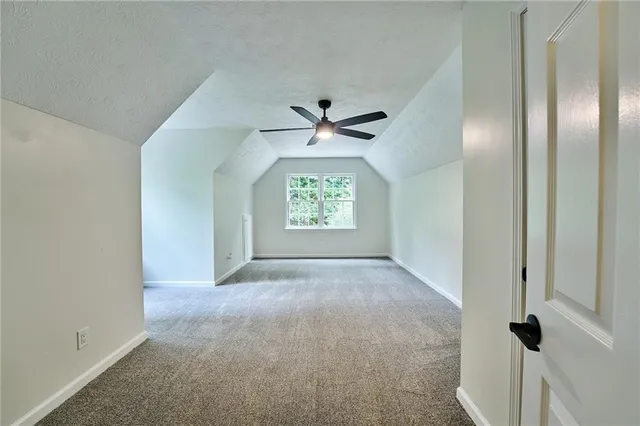 a living room with a fireplace and a wooden floor