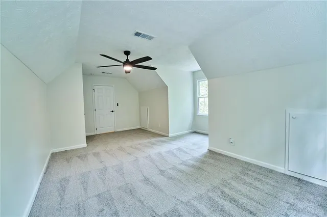 wooden floor in an empty room with a fireplace