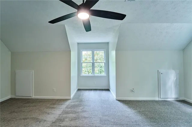 a kitchen with stainless steel appliances kitchen island granite countertop a refrigerator and microwave