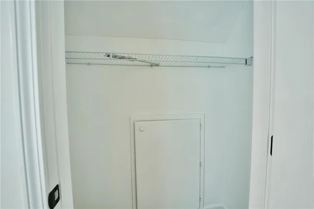 a large kitchen with stainless steel appliances granite countertop a stove a sink and a microwave