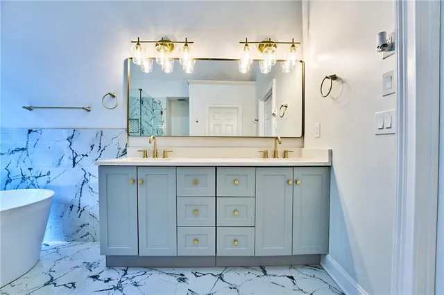 a bathroom with a sink and a mirror