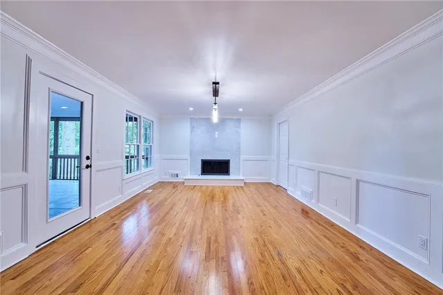 a front view of a house with a yard table and chairs