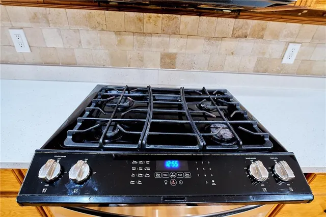 a backyard of a house with yard and outdoor seating