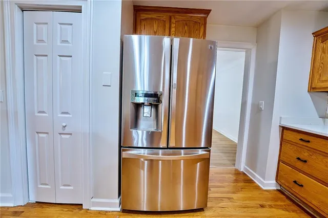 a front view of a house with a garden and yard