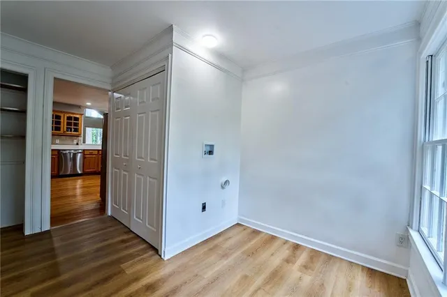 an aerial view of a house with a yard and large trees