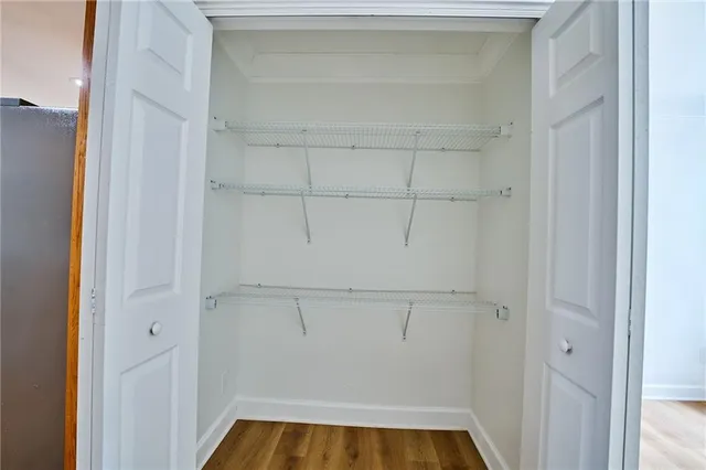 a view of a yard in front of a house with large tree