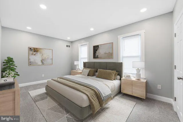 a view of a livingroom with a chair and a couch