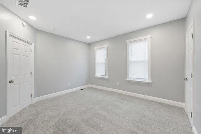 an empty room with windows