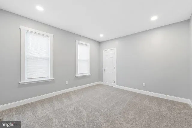 an aerial view of a house with swimming pool