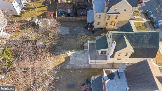 an aerial view of residential houses with city view
